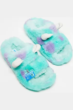 Crocs – Flerfärgade, lurviga tofflor med Sulley från Monsters Inc-design