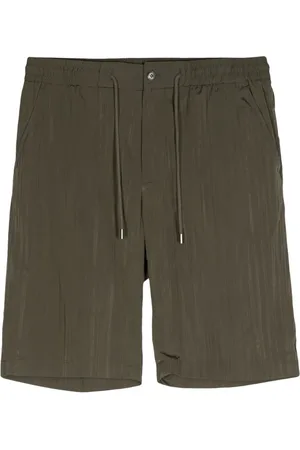 MAN ON THE BOON. Plisserade shorts med dragsko