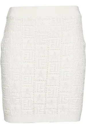 Balmain Pointellestickad minikjol med monogram