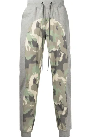 MOSTLY HEARD RARELY SEEN Avsmalnande sweatpants med kamouflagemönstrad panel