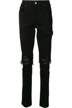AMIRI Smala jeans med slitning
