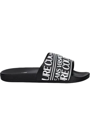 VERSACE Skor, Herr, 44 EU, Svarta Slide Sandaler med Relief Logo