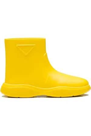 Prada Skor, Dam, 36 EU, Gula Ankelboots med Relief Logo