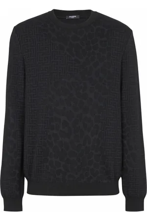 Balmain Stickade tröjor & koftor, Herr, L, Bomull, Monogramstickad och leopardmönstrad tröja