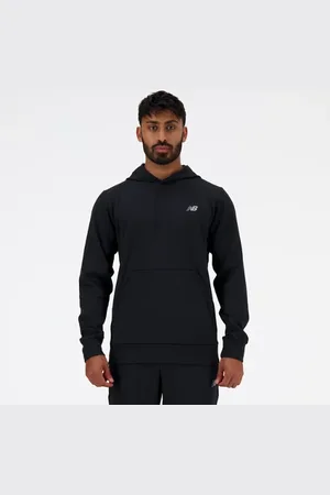 New Balance Män Tech Knit Hoodie i Black Poly sticka
