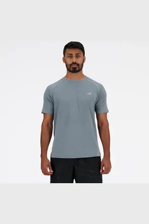 New Balance Män Knit T-Shirt i Grey Poly sticka